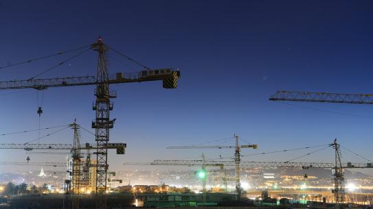 image of cranes at night time