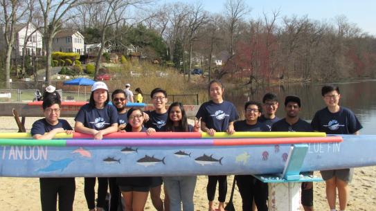 canoe team with boat