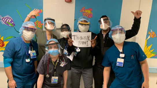 group of doctors wearing face shields