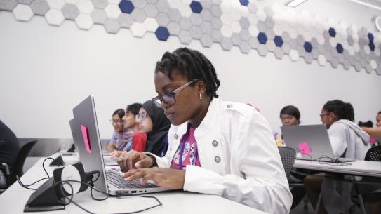 Girls coding during the K12 summer program