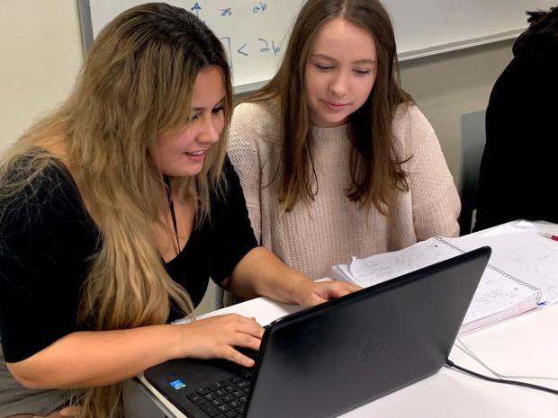 Photo of a tutor working with a student
