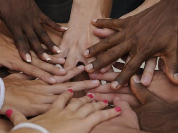 picture of multiethnic hands in a circle
