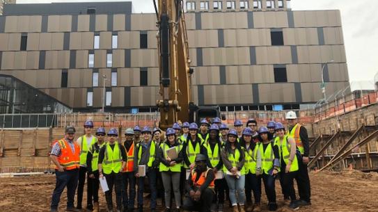 Photo of students at the construction site 