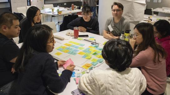 students using post-it notes to hack climate change