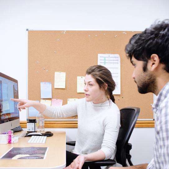 Students looking at computer