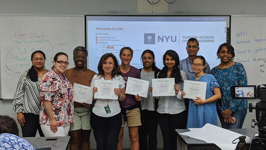 teachers posing with certificates