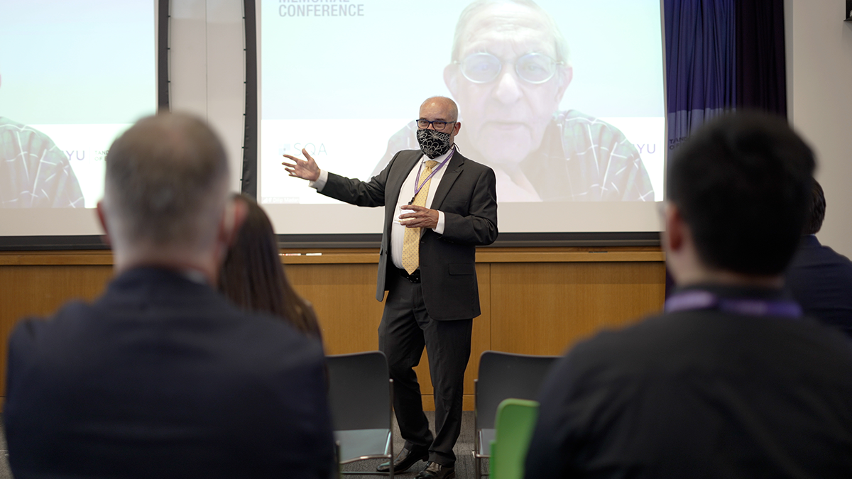 Prof. David Shimko in front of presentation screen