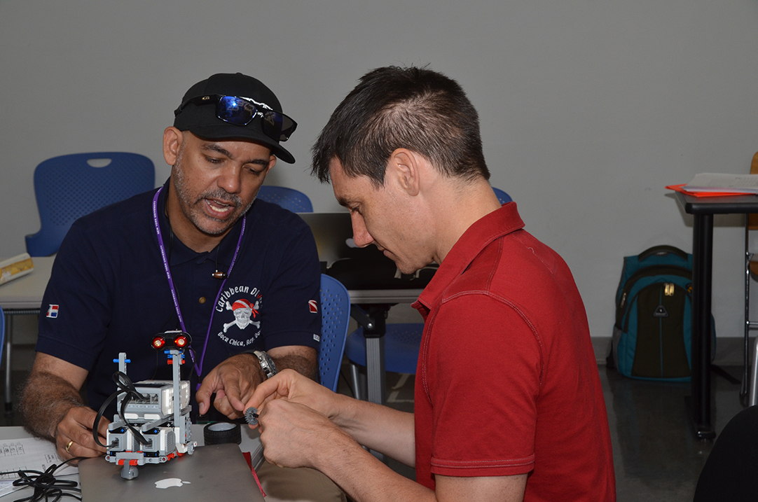 teachers working on a robot